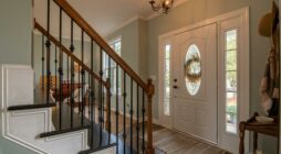 Brown Wooden Staircase With Brass Chandelier